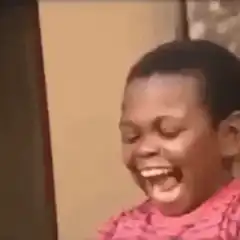 Girl laughing hysterically with tissue