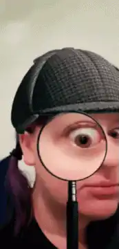 Woman with magnifying glass over eye