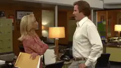 Pam and Jim talking in the office