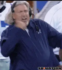 Mike McCarthy yelling and pumping fist