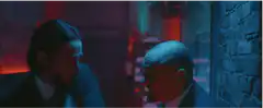 John Wick grabs a man by the throat