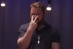 Comedian points at camera