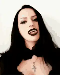 Goth vampire woman showing fangs