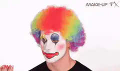 Person putting on clown nose