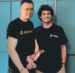 Binance and FTX founders with cartoon hand