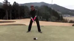 Man hits golf ball and falls over