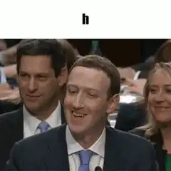 Mark Zuckerberg laughing with letter h