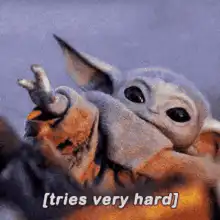 Baby Yoda tries very hard