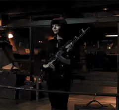Woman holding an assault rifle