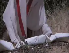 Roman soldier unrolls scroll