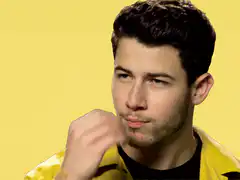 Nick Jonas hand gesture