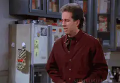 Jerry Seinfeld looking down then up