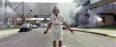 Joker in hospital gown walking forward
