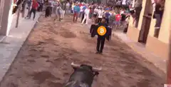 Bull runs at man with Bitcoin cape