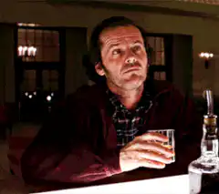 Jack Nicholson smiling with a drink