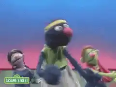 Grover singing with other Muppets