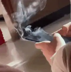 smoking smartphone in hands