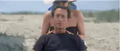Woody Allen getting a massage on the beach