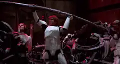 Princess Leia holds a blaster rifle