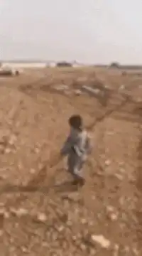 Toddler running towards camera