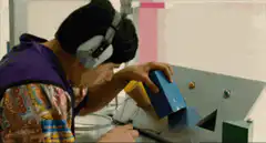 Kid trying to fit square box in round hole