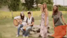 hippies dancing in field