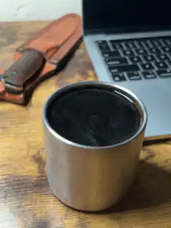 steaming metal cup on desk