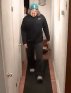 Man does a backflip in a hallway