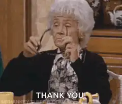 Lucille Ball puts on sunglasses