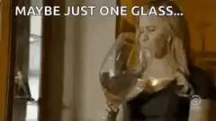 Woman drinking from giant wine glass