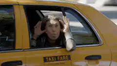 Elaine Benes in taxi window
