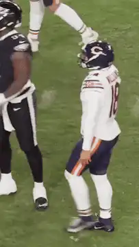 Chicago Bears player points and walks