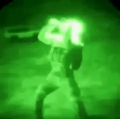 Night vision soldier firing weapon