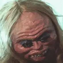 Creepy blonde woman with large teeth