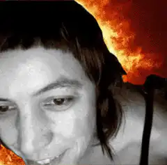 woman smiling with fire background