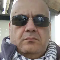 Bald man in sunglasses and scarf