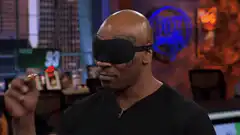 Mike Tyson blindfolded throws dart