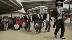 Funeral band dancing with coffin