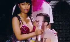 Nicki Minaj hugs fan on stage