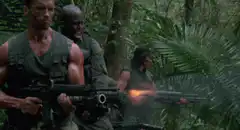 Predator soldiers firing weapons in jungle