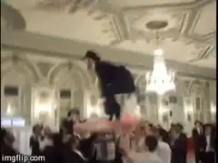 Man in top hat crowd surfing