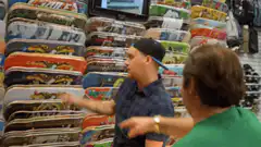 Duncan points at skateboard deck