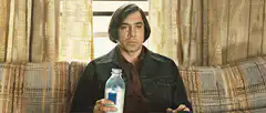 Javier Bardem holding a bottle of milk