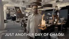 Man standing calmly in chaotic office