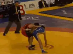 Wrestler throws opponent in a match