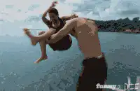 man throws woman into water