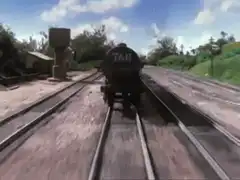 James the Red Engine passes the Tar Engine