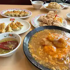 Chinese food spread with soup and dumplings