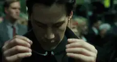 Neo puts on sunglasses