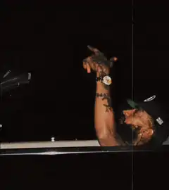 bearded man pointing up at night